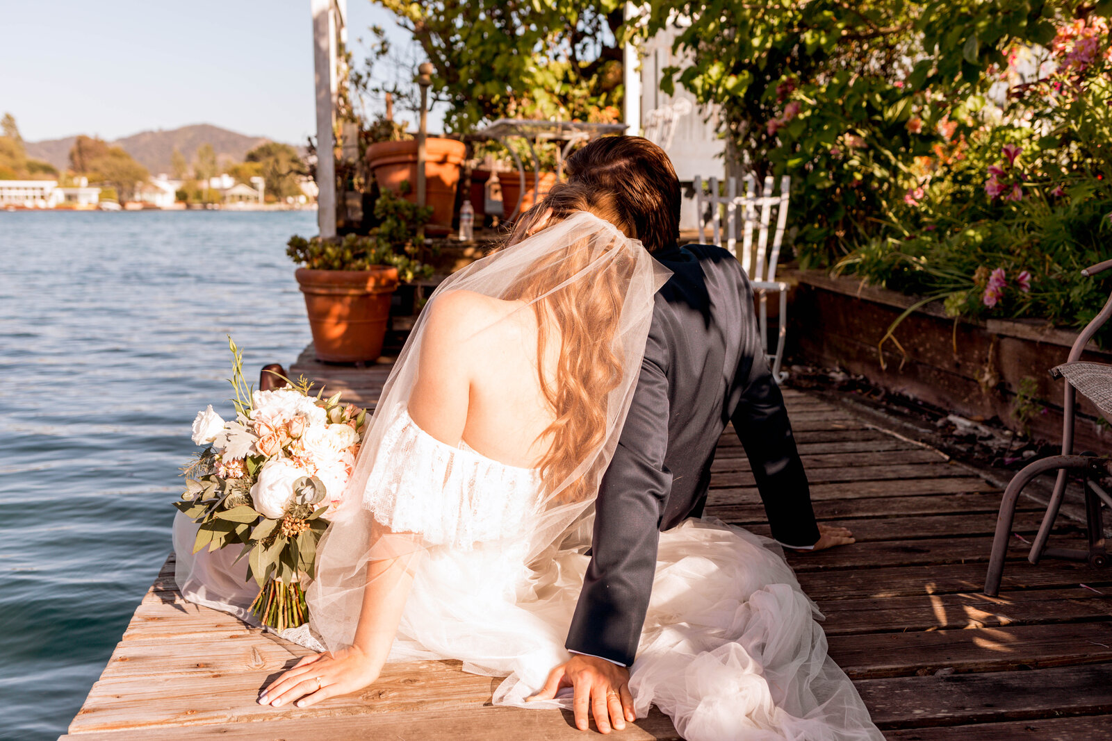 couple holding each other in field
