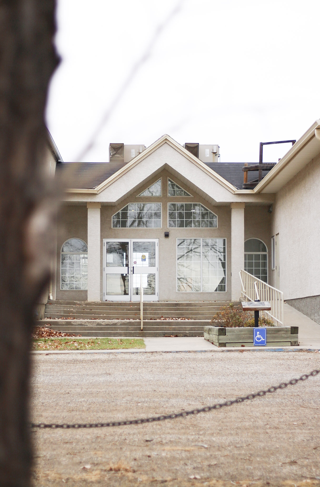 Exterior view of Bergthal Event Centre, a rustic wedding venue in Alberta with scenic outdoor space