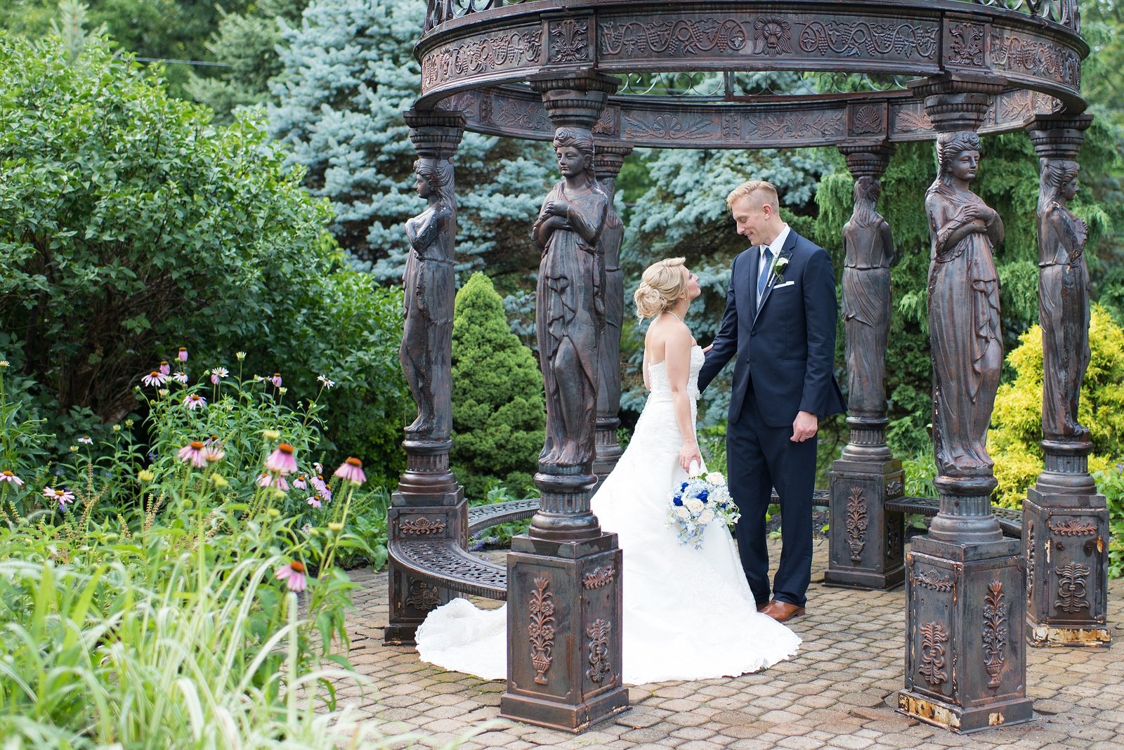 Bride and Groom looking at each other in garden at Villa Borghese Wedding Reception in Wappinger Falls, New York Photo
