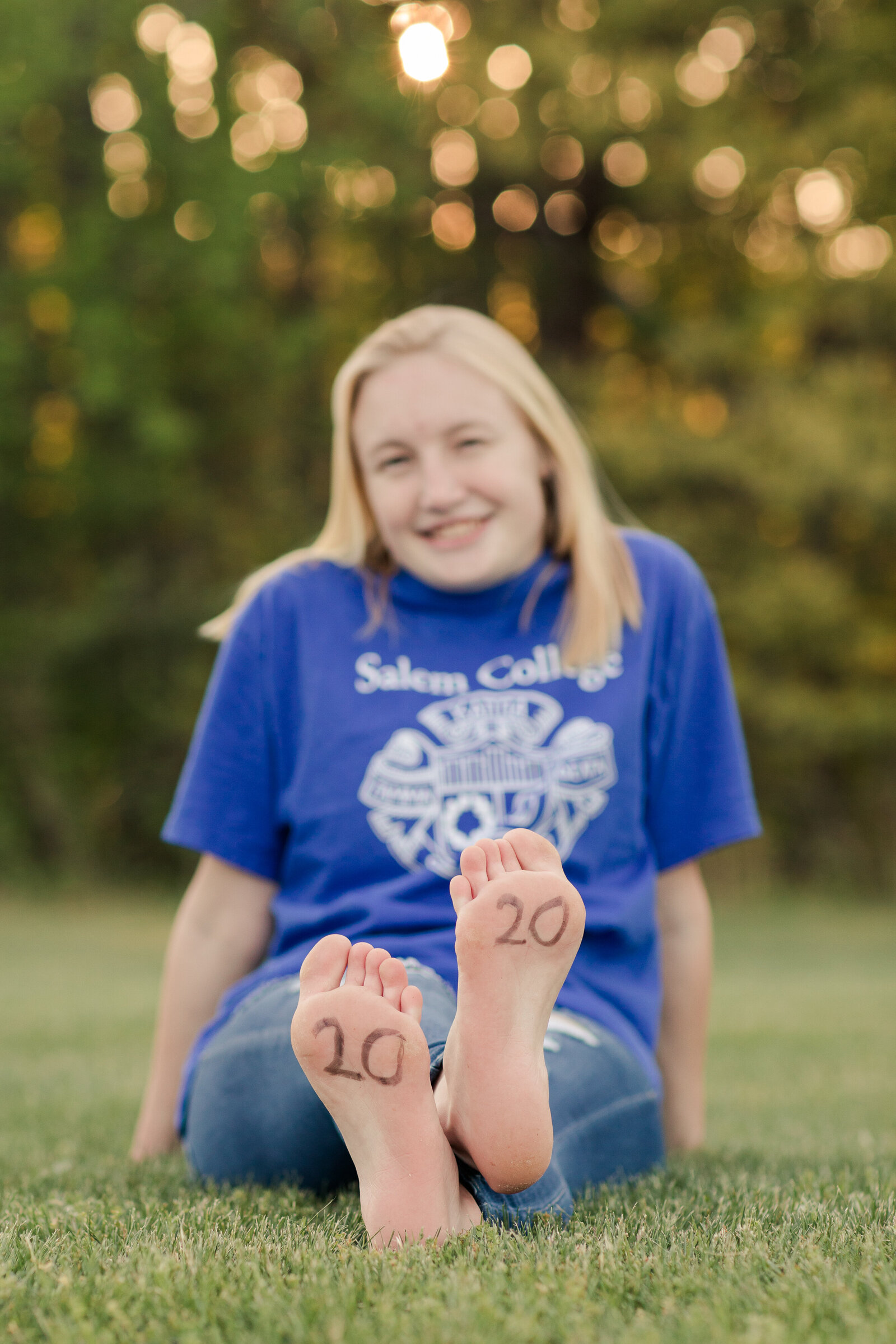 senior girl with 2020 written on her feet