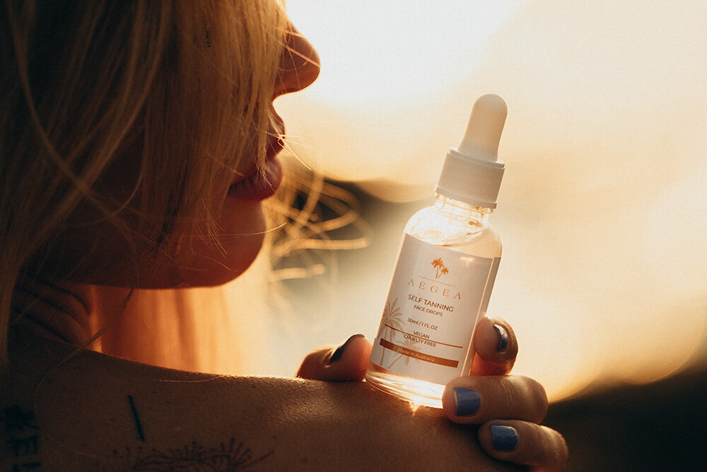 Brand photography session showcasing a skincare product held in natural sunlight, highlighting authenticity and simplicity.