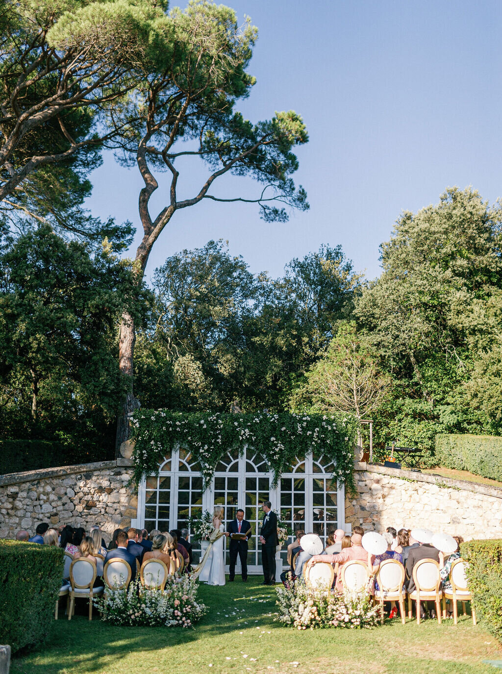 intimate-ceremony-in-French-orangery-decorated-with-greenery-and-flowers