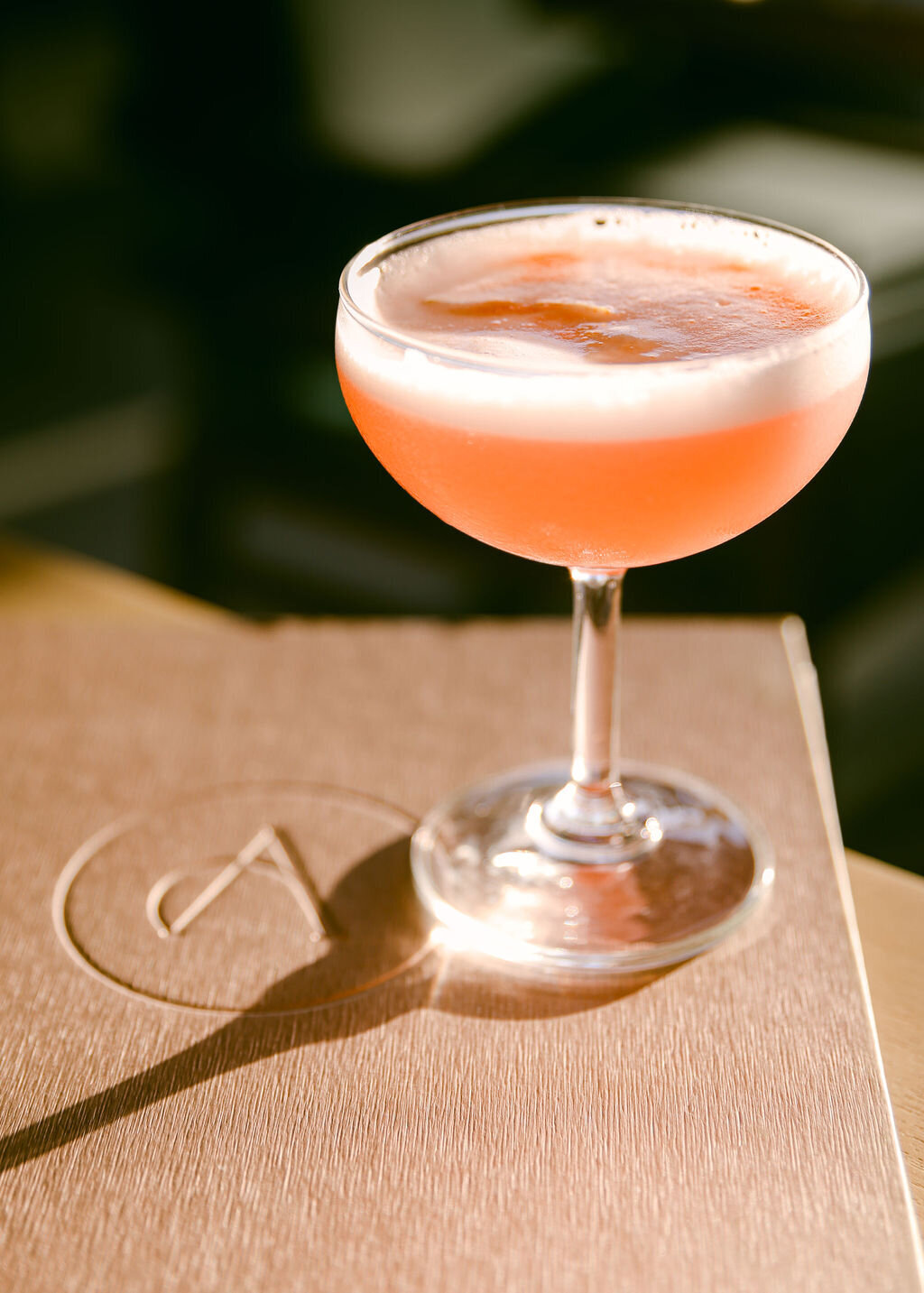 Luxury hotel photographer cocktail on menu at bar with good light