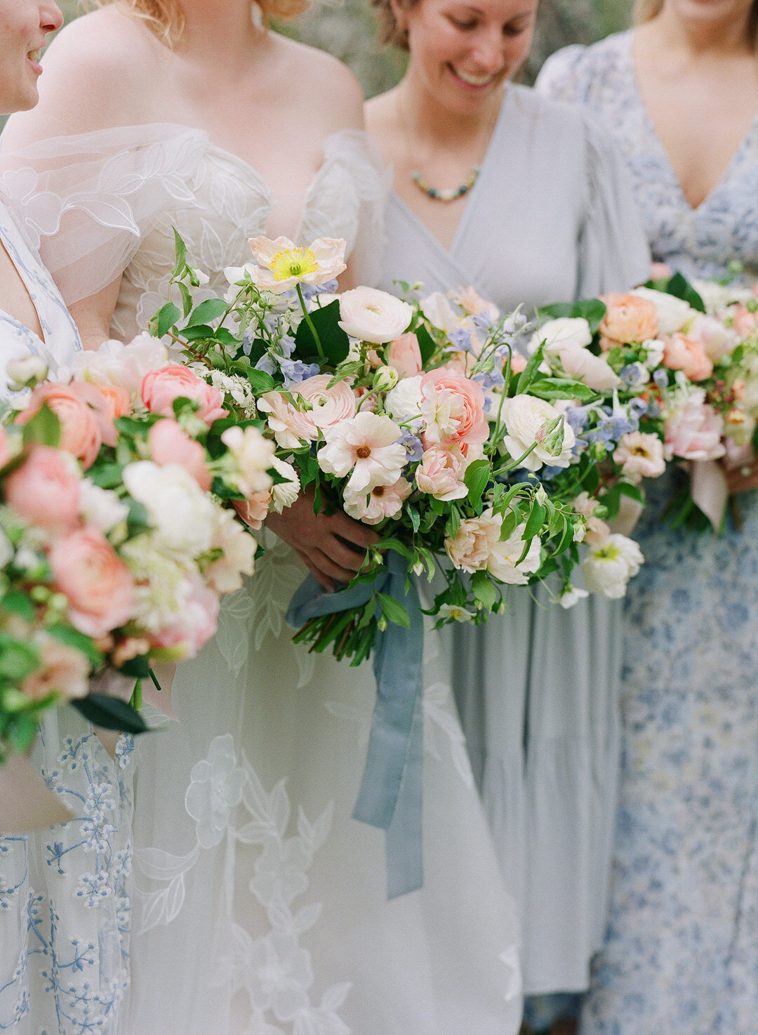 bride and bridesmaids holding bouquets