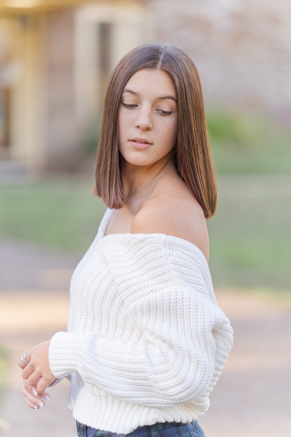 high school girl serious looking down during Alexandria, Virginia senior pictures
