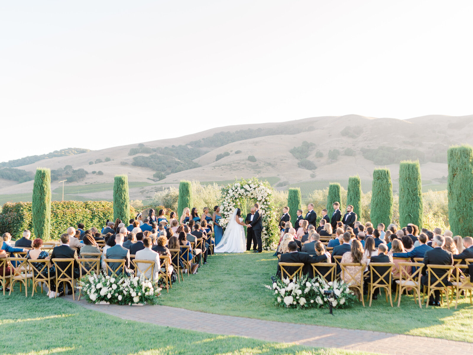 outdoor wedding reception in a garden with a beautiful view