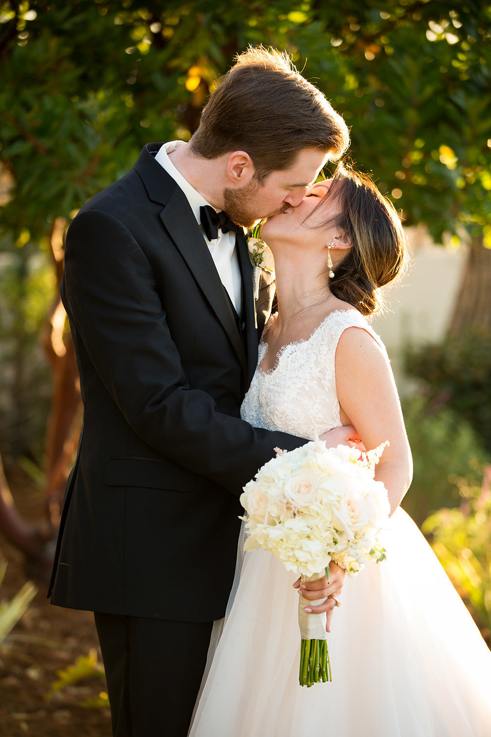 bride and groom kissing