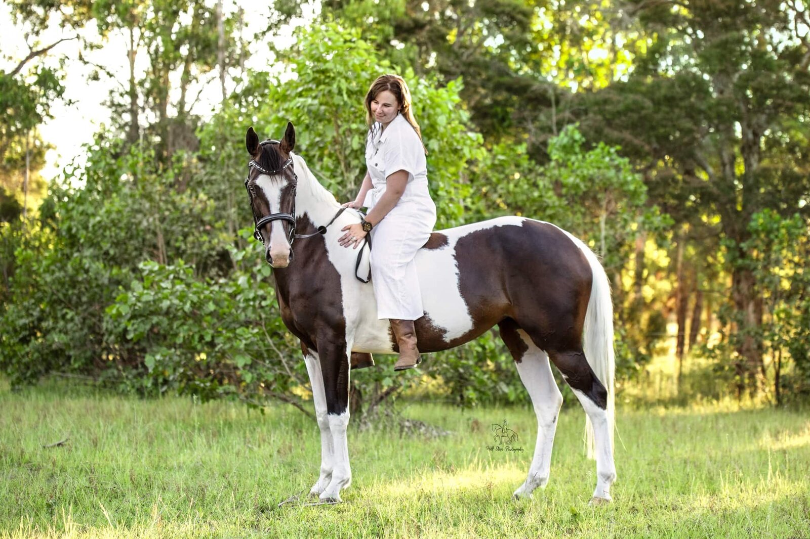 29. Woman pats pinto horse riding bareback Half Steps Photography