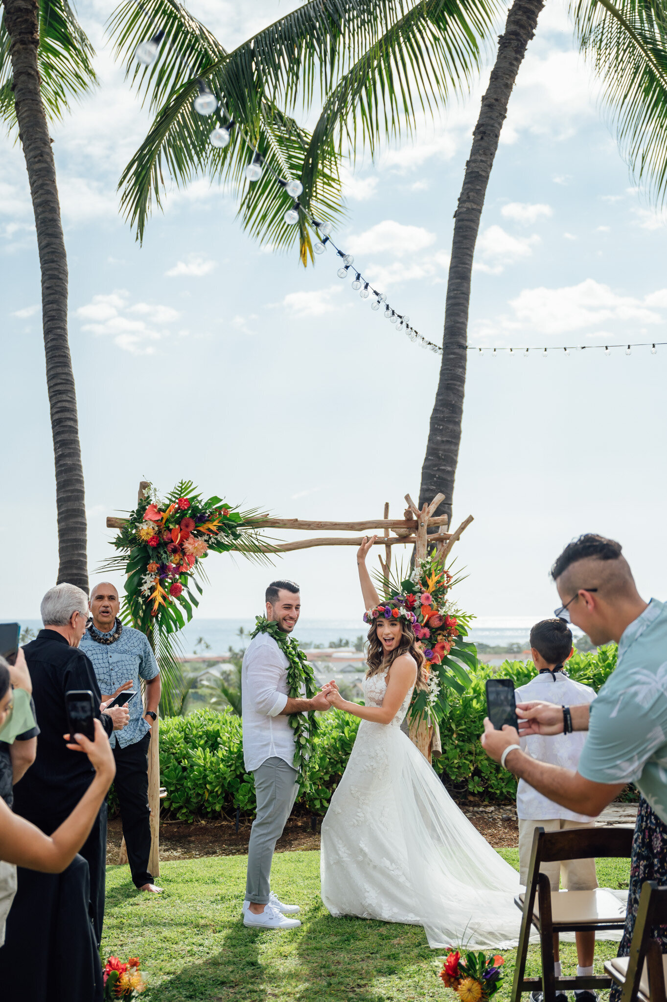 happy bride cheering on her wedding day in kona hawaii