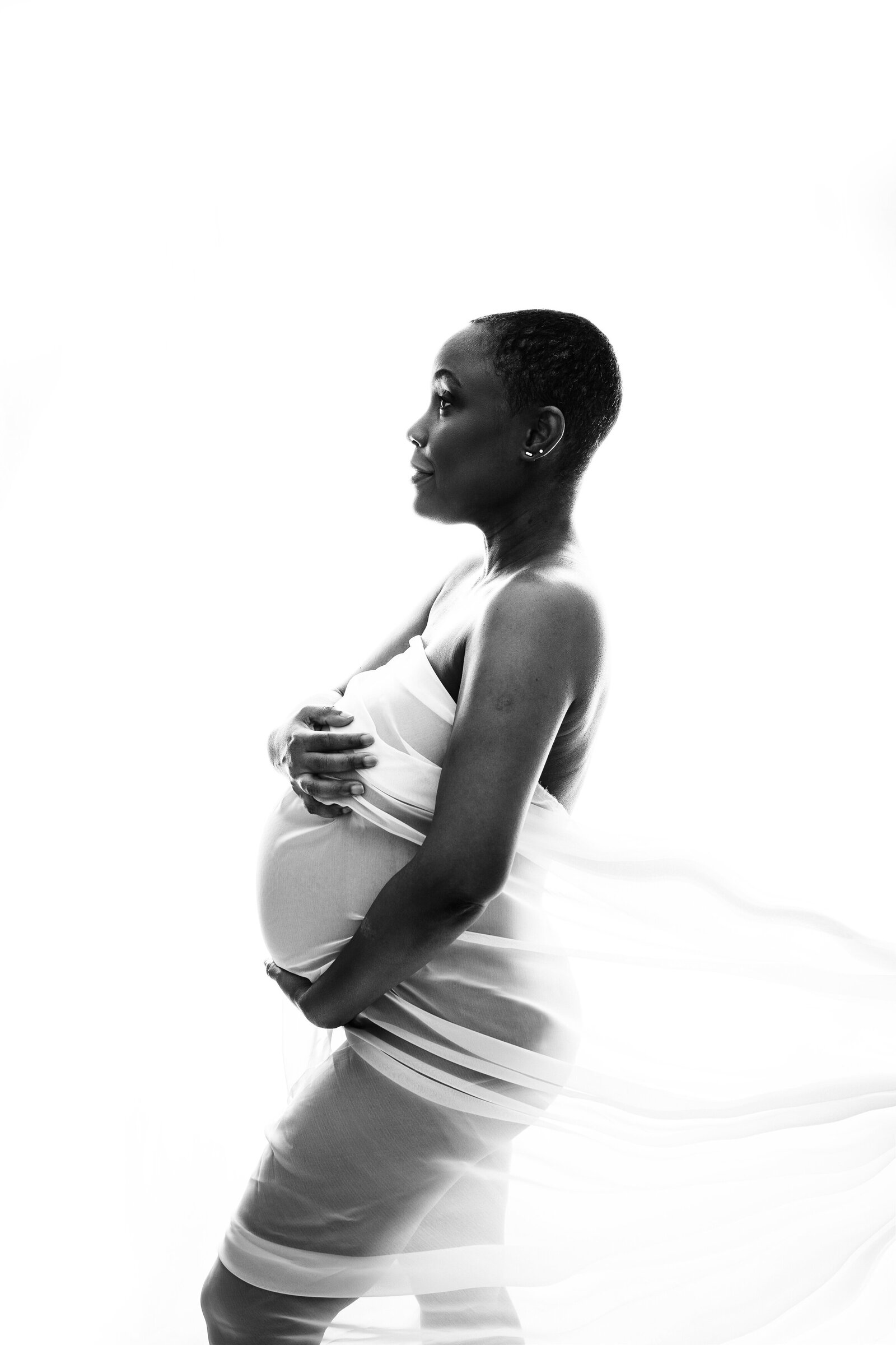 black and white image of mom during studio maternity session in Lutz