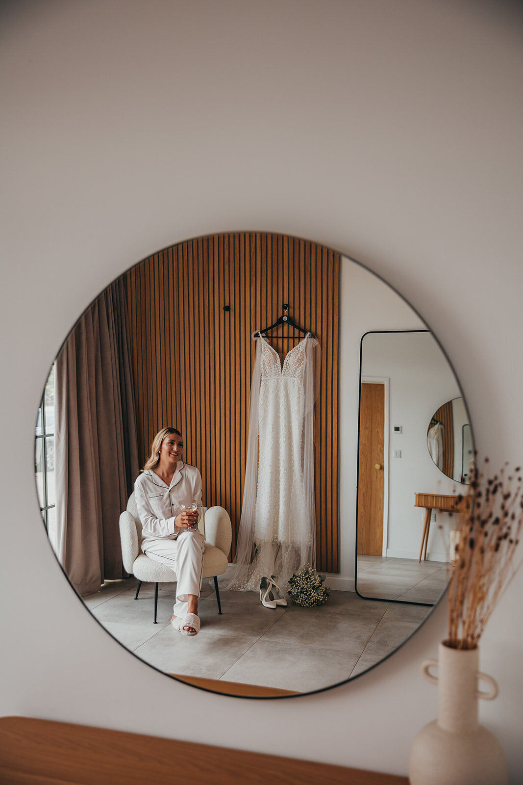 bride sits in chair in PJ's