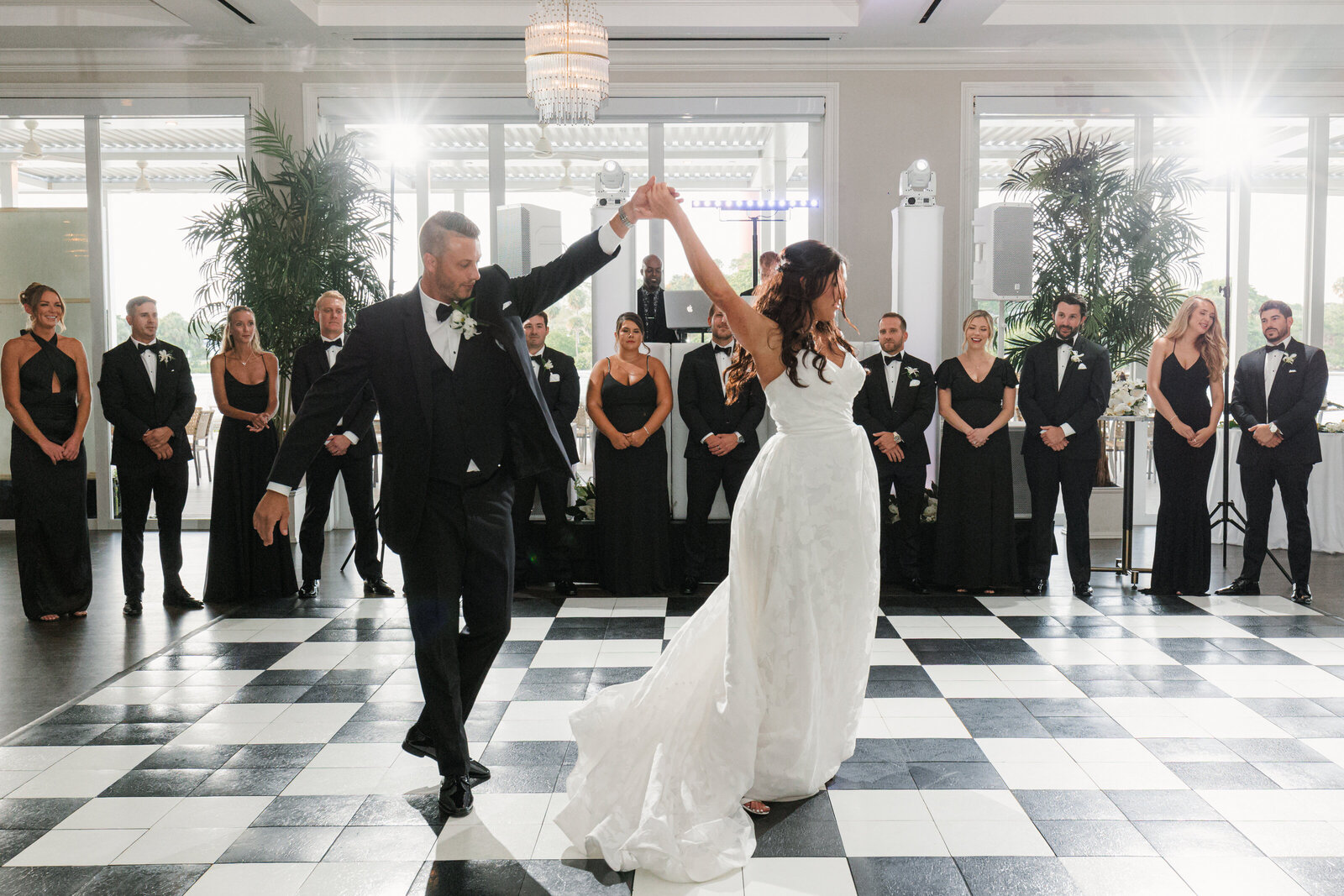 Bride and Groom dancing during their first dance at the Pelican Club in Jupiter, Florida. Photo by Maggie Alvarez Photography