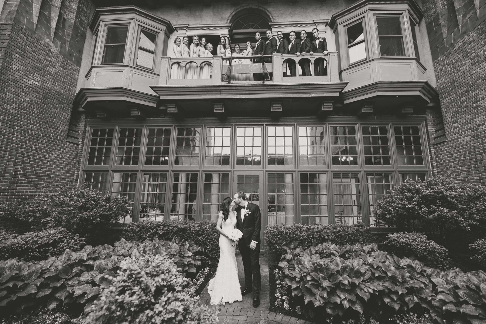 Bride and groom and bridal party at the piazza at Coindre Hall