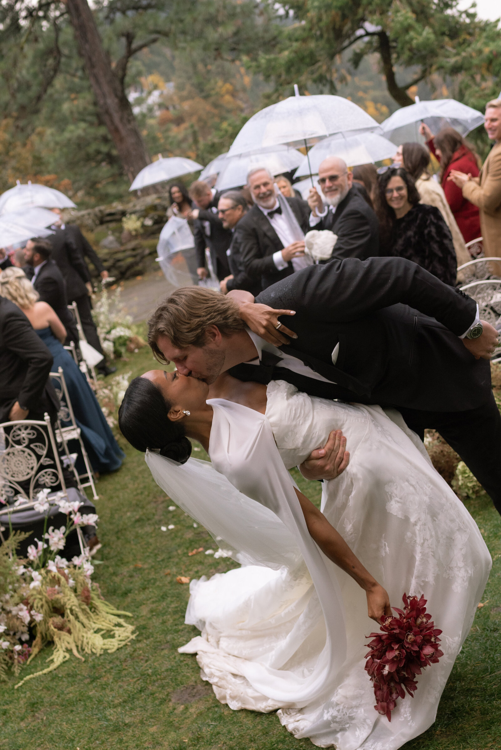 Couple celebrating at the end of the aisle at The Griffin House in Hood River, OR