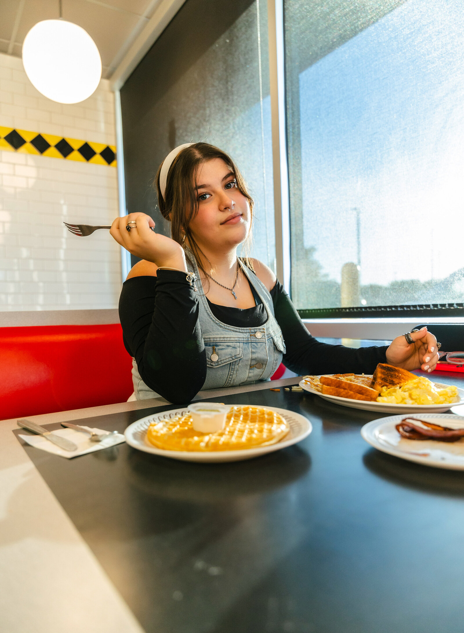 teen eating waffles