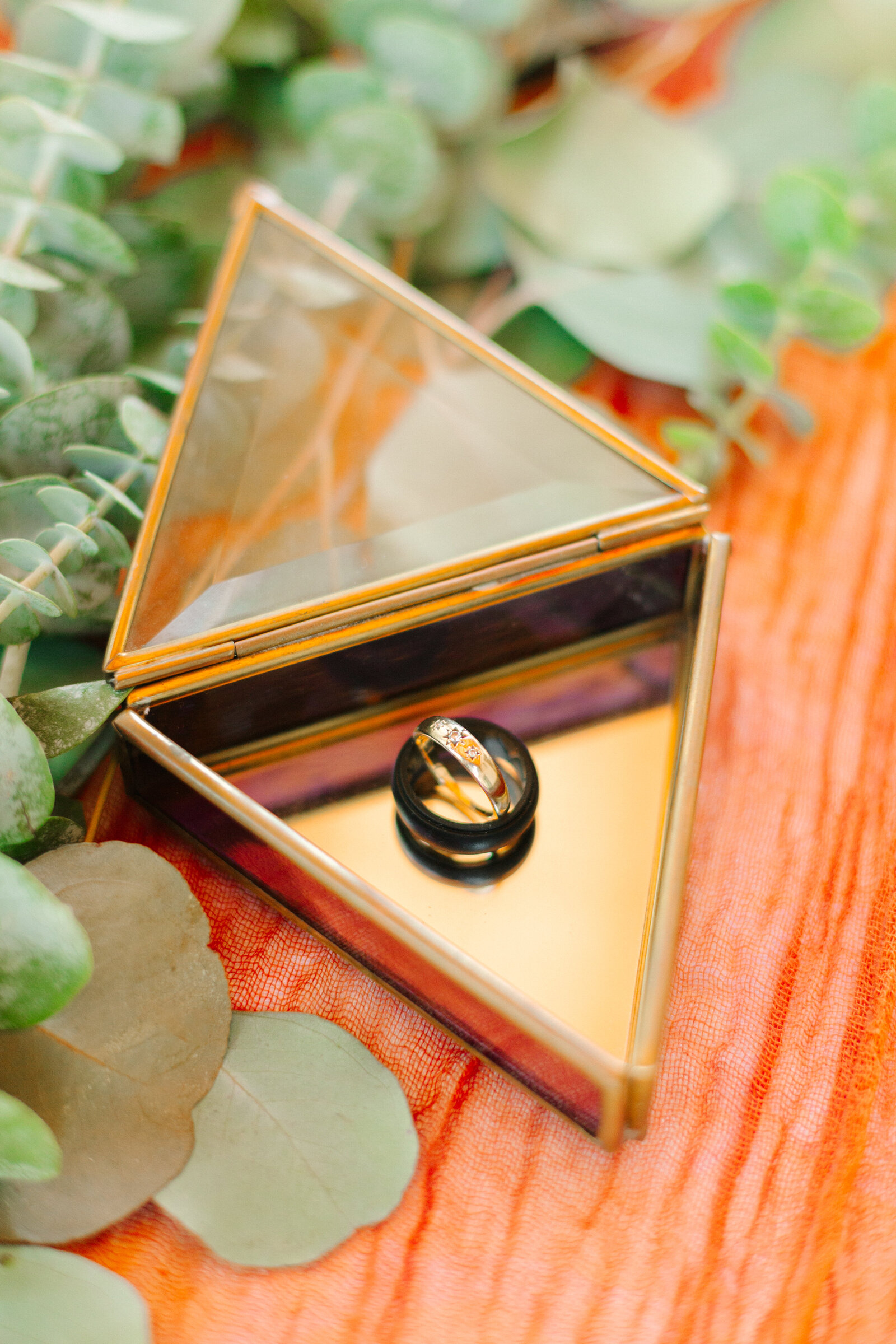 Colorful and boho wedding rings at an intimate elopement at a cabin at Big Bear Lake, California.