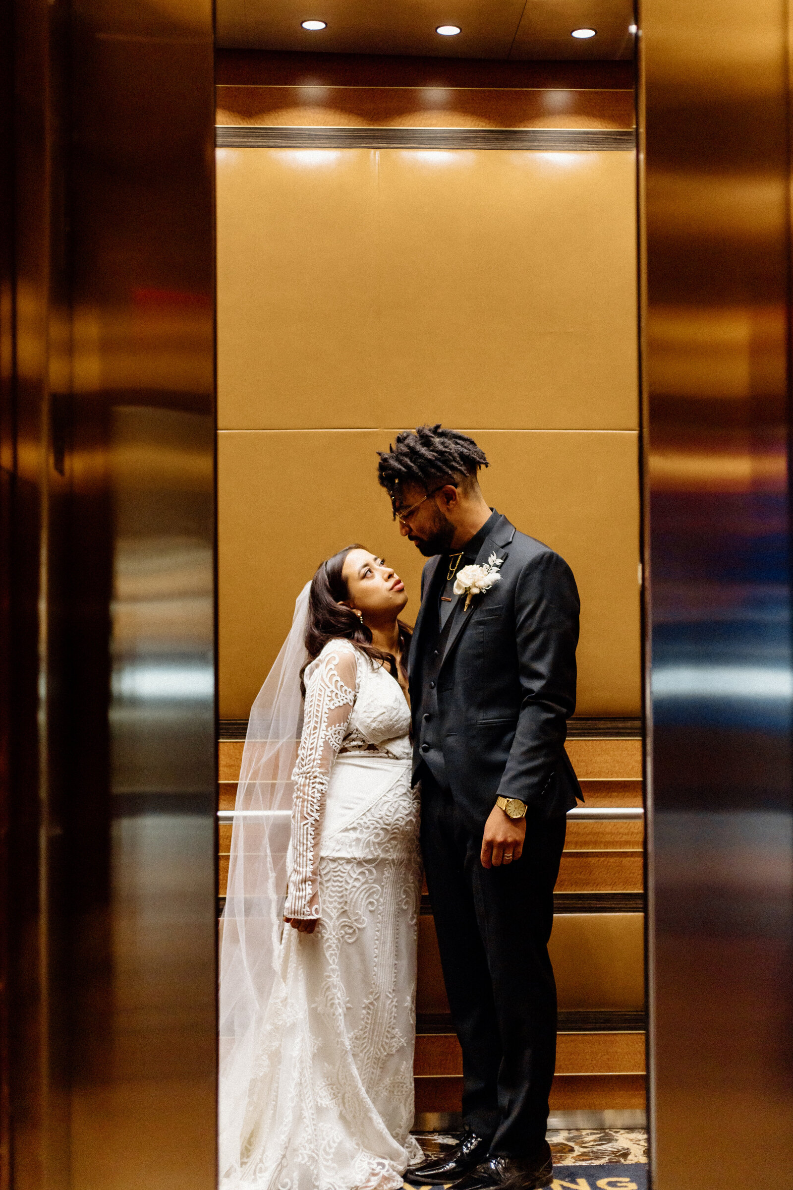 bride and groom  in elevator