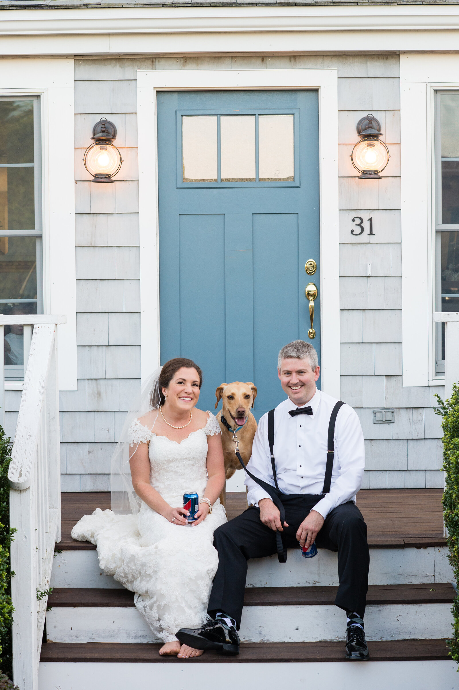 couple site casually with dog and beer