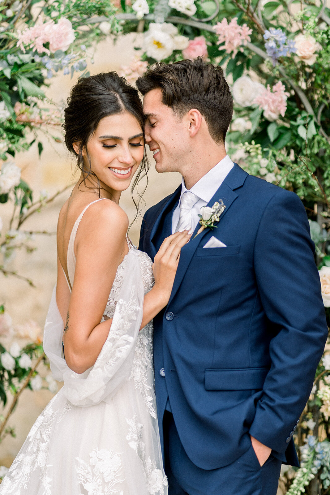 Bride and Groom Embrace at Sunstone Winery Courtyard