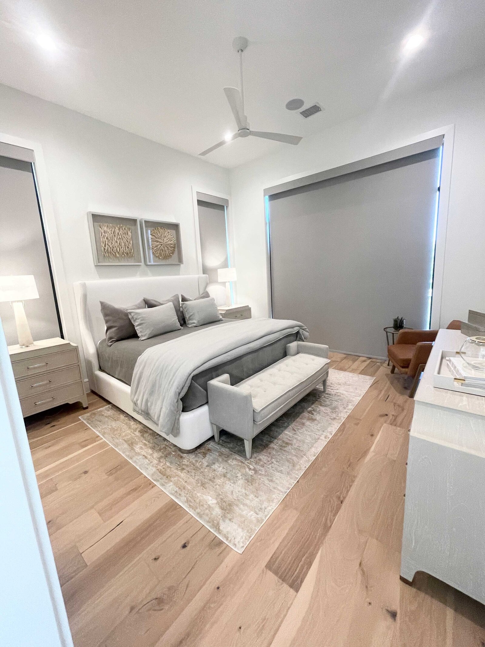 A bedroom project by Frisco interior designers, featuring elegant grey and white decorations designed for the main bedroom.