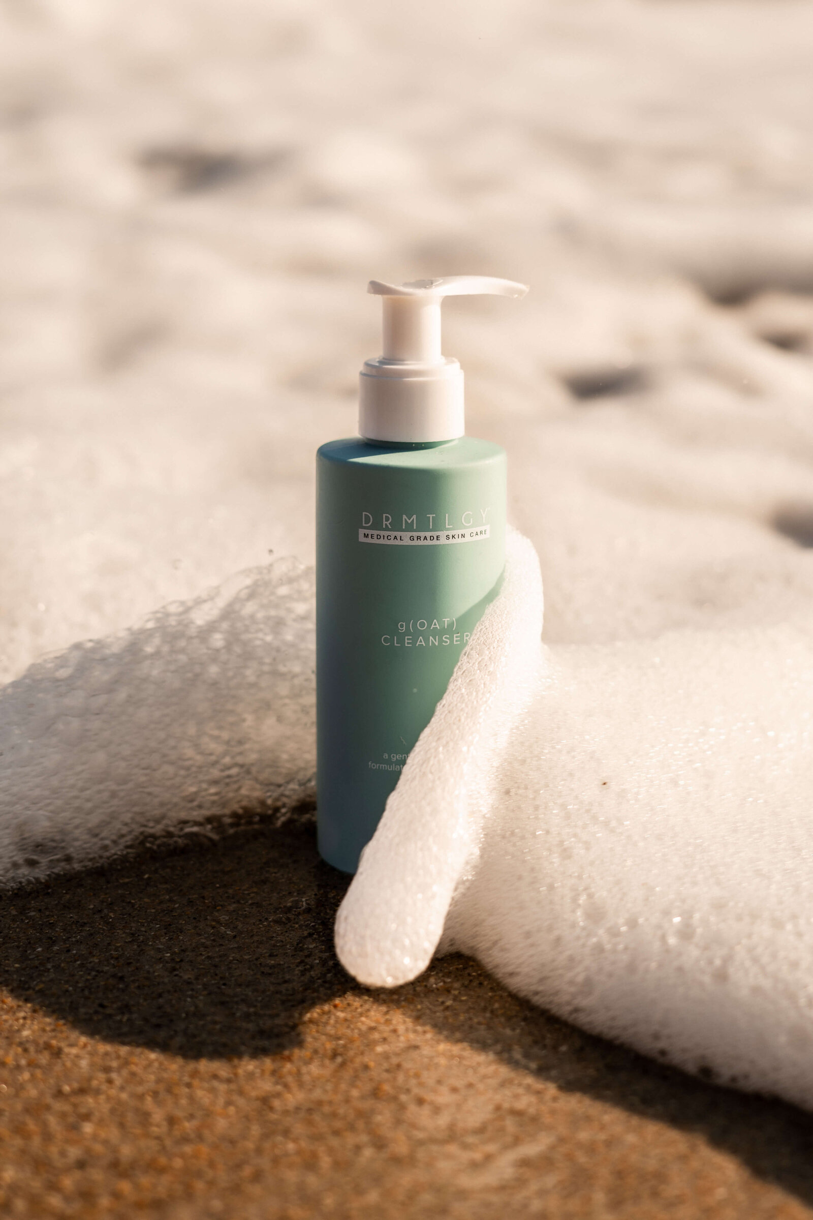 Skincare product up close on beach