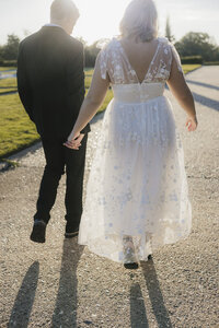 fallback shared on Invalid Date | an engaged couple holding hands while walking
