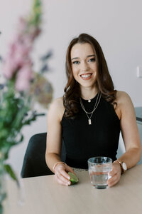 fallback shared on Invalid Date | Dietitian Annabel holding a glass of water with a slice of lime, emphasising the importa...