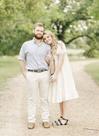 fallback shared on Invalid Date | engaged couple standing together holding hands