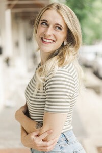 fallback shared on Invalid Date | Shelby smiling in a green and white striped shirt