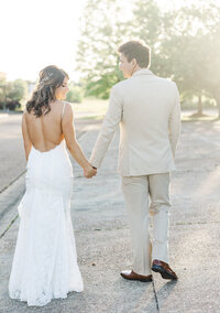 fallback shared on Invalid Date | bride and groom holding hands while walking