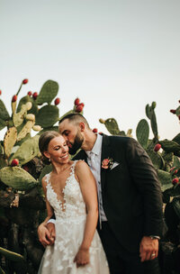 groom-kissing-brides-cheek-cactus