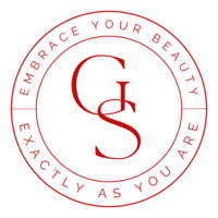 Red circular logo for Gina Spanos Photography featuring GS initials and the message “Embrace Your Beauty Exactly As You Are,” symbolizing empowerment and luxury boudoir photography in Vancouver.