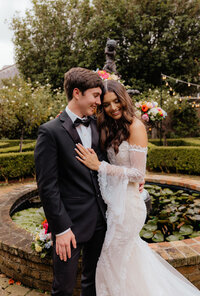 bride and groom embrace after destination wedding ceremony