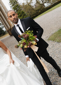 blurry black and white image of two models wearing sparkly wedding dress minis