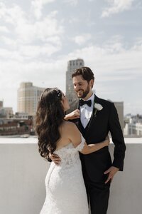 bride and groom portrait on a rooftop