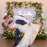 we crafted a neon of a last name couple's last name