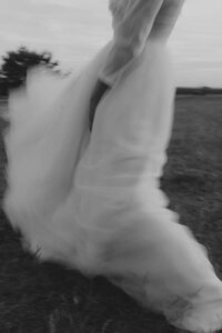 Bride is dancing in a wedding dress.