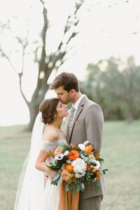 Wedding Photography, groom kissing bride on her forehead