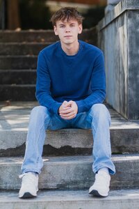 Senior Boy Sitting on Stone Steps