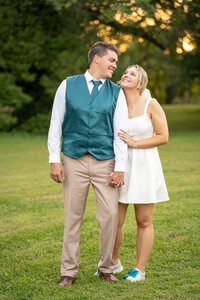 Bride and groom smiling during golden hour photos at Historic Tuckahoe in Richmond, Va