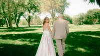 bride looks back at outdoor session while walking