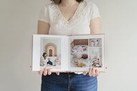 Jess Morgan holding open family photo album