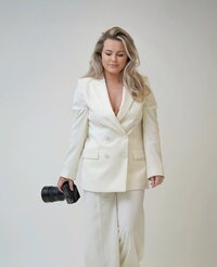 Headshot of Danielle from Belle Lumière Photography wearing a structured blazer — part of her refined brand presence