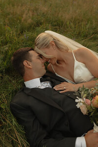 bride and groom embrace on wedding day in pei