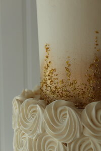 sparkly gold wedding cake|buttercream rosettes