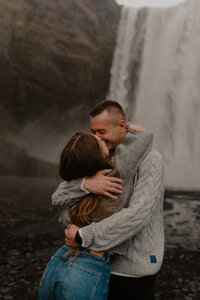 couple in front of skogafoss