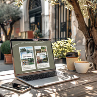Travel blogger showit website showing on a macbook pro screen siting on a cafe table.