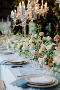 Classic reception decor with florals and candle chandeliers at a New Jersey wedding.