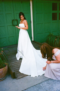 bridesmaids helping bride get ready