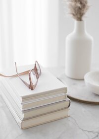 Books stacked on table